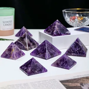 Natural purple crystal pyramid ornament, raw mineral energy stone for home and office decor.