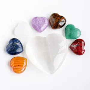 Natural crystal heart shaped gemstone set with selenite tray for home decor display.