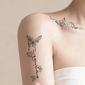 Black and white butterfly temporary tattoo stickers for collarbone and arm, delicate floral design.