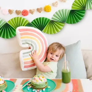 Green paper folding fan bunting decoration for spring summer party wedding celebration layout.