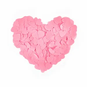 Pink heart confetti paper pieces for wedding party table scatter and romantic celebration decor.