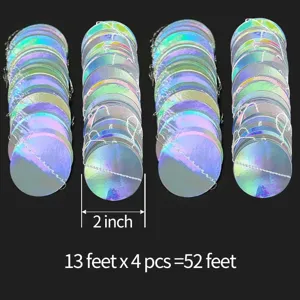 Detail view of holographic round paper disc garland, shiny reflective finish for party decor.