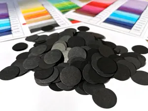 Black round paper confetti dots detail shot for party decoration and gift box filling crafts