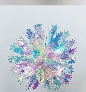 Iridescent holographic snowflake hanging decoration for Christmas party holiday decor and window display.