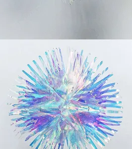 Holographic iridescent film hanging ornament detail view, shiny festive party decor item.