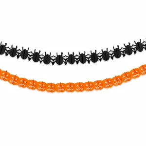 Halloween paper garland detail showing intricate spider and pumpkin cutout designs for party decor.