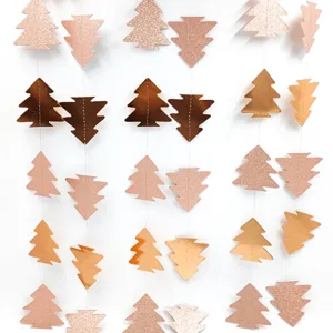 Close-up of glitter metallic Christmas tree paper garlands for festive holiday party decor.