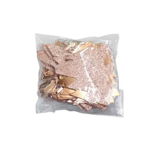 Rose gold glitter Christmas tree paper hanging decorations for holiday party and festive decor.