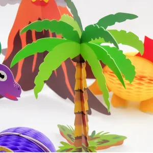 Detailed view of paper palm tree and dinosaur honeycomb party decoration for kids birthday.