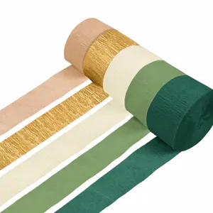 Sage green and gold crepe paper rolls set for wedding party decoration and crafts.