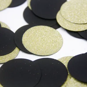 Black and gold round paper confetti for wedding birthday party table scatter decorations.