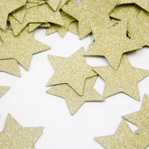 Gold glitter star confetti close-up view, ideal for wedding party and birthday decorations.
