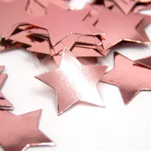 Rose gold star confetti for wedding and birthday party table scatter decorations.