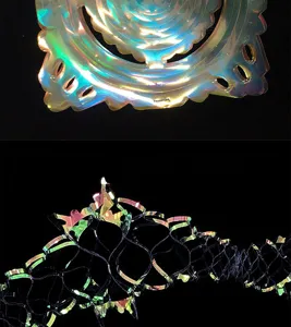 Iridescent film rainbow garland detail close-up showing holographic reflective party decoration texture