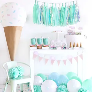 Mint green paper tassel garland and party decoration set for wedding birthday celebration setup.