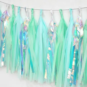 Mint green and iridescent paper tassel detail, perfect for wedding and party decorations.