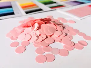 Pink round paper confetti fill for party decoration, wedding table scatter and gift box packaging.