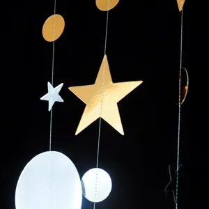 Gold and silver star and circle hanging garland detail for party, wedding and Christmas decor.
