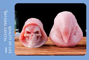 Natural pink crystal grim reaper skull carving statue Halloween home decor ornament.