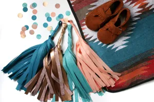 Detailed view of colorful paper tassels party garland for room wedding birthday decor