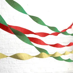 Detailed view of colorful red, green and gold crepe paper streamers for festive party backdrop.