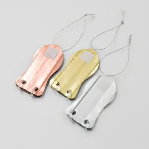 Metal shoe shaped hanging pendants, set of three charms in copper, gold and silver.