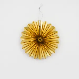 Close-up details of the gold metallic paper folding fan decoration with hanging string.