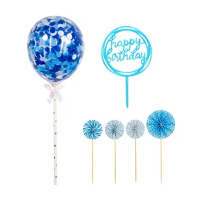 Blue birthday cake topper set detail showing confetti balloon, acrylic sign and paper fan decor.