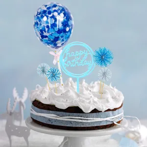 Blue birthday cake decoration set with confetti balloon paper fan and happy birthday topper.