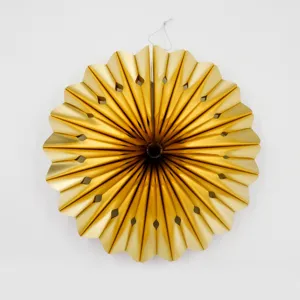Gold metallic paper fan decoration with hollow cutouts, perfect for party and wedding decor.