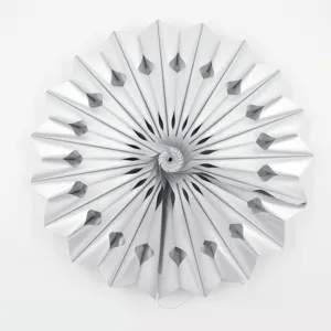 Detailed view of white hollow folding paper fan, perfect for party and wedding decoration.