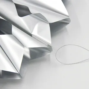 Silver metallic foil paper folding fan detail for party wedding hanging decoration DIY craft.