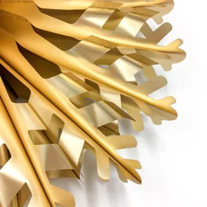 Gold metallic paper fan detail shot, 3D origami decoration for party wedding celebration.