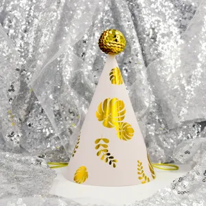 Kids birthday party cone hat with gold leaf pattern and shiny sequin top ball decor.