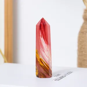 Red and yellow smelted crystal tower, polished six-sided mineral column for crystal healing.