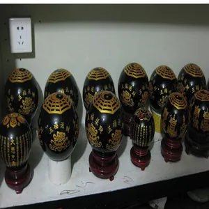 Black obsidian sphere ornament with golden carving traditional Chinese blessing text for home decor.
