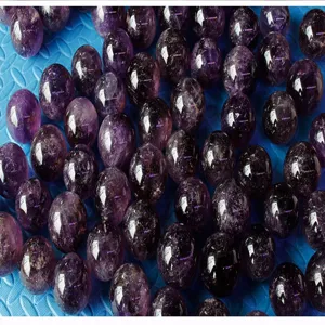 Natural amethyst crystal spheres detail shot, polished purple gemstone balls wholesale.