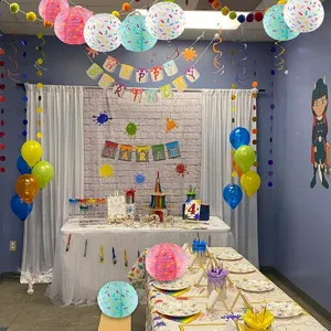 Colorful sprinkle paper lanterns for kids birthday party decoration, hanging round donut theme decor.