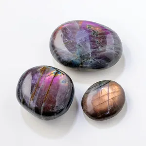Natural purple labradorite palm stones set, polished crystal mineral specimen for home decor.