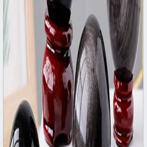 Silver obsidian crystal stone ornament detail showing polished texture and red base.