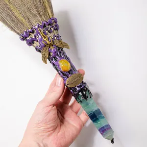 Detailed close-up view of natural fluorite crystal witch broom with exquisite fairy charm.