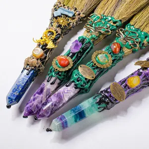 Natural crystal hexagonal column miniature broom ornaments with tumbled stones and metal charms for decor.