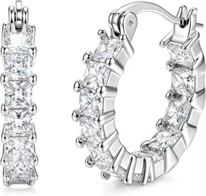 Detail shot of silver-tone hoop earrings encrusted with sparkling square-cut cubic zirconia stones.