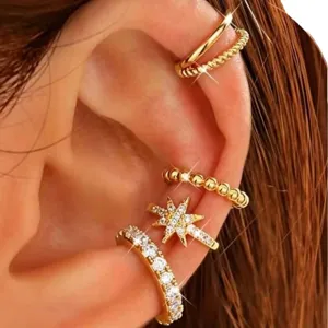 Gold plated multi-piece ear cuffs set with sparkling cubic zirconia and star design for women.
