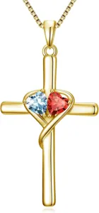 Gold plated cross necklace with intertwined heart design and dual colored gemstone pendants.