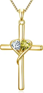 Detail view of the gold-plated cross pendant necklace featuring dual sparkling heart gemstones.