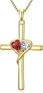 Close-up of gold cross pendant necklace with red and white crystal interlocking hearts.