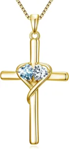 Detail view of the exquisite gold cross necklace featuring interlocking dual heart pendant.