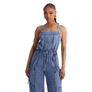 Detail view of women's casual denim jumpsuit with utility pockets and metal hardware.