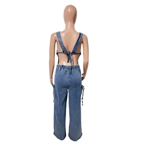 Detail view of women's backless denim jumpsuit, casual wide-leg overalls with cargo pockets.